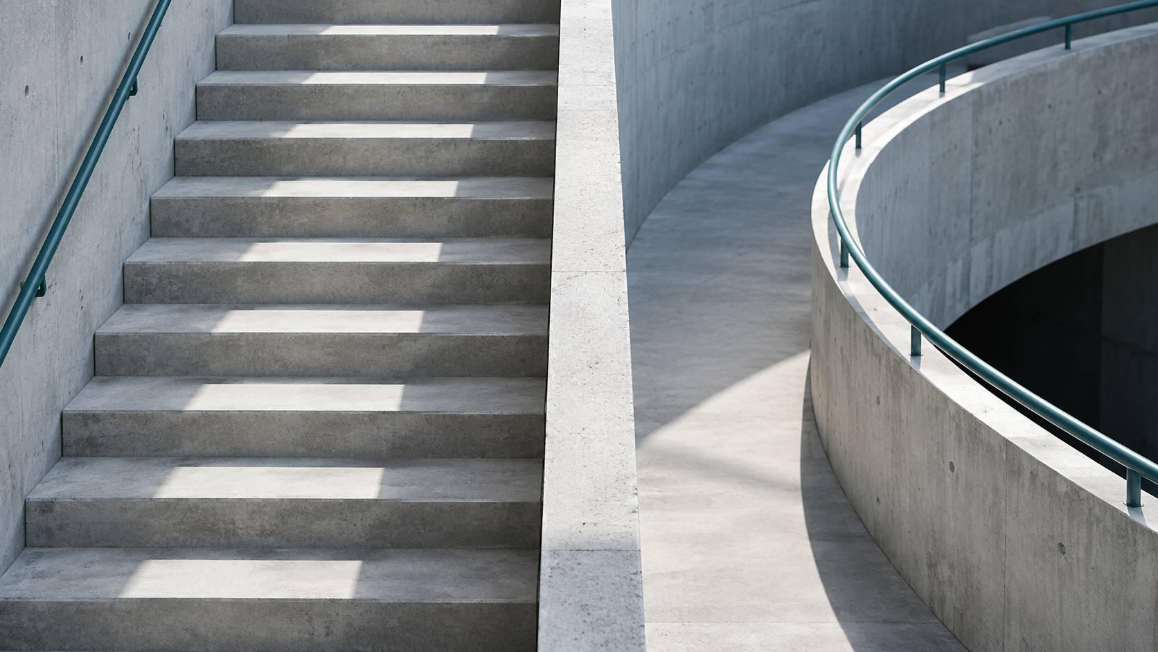 A staircase beside a curved ramp: two different ways to make progress.